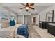 Spacious main bedroom with carpet, ceiling fan and direct access to ensuite bathroom at 417 Carvell Dr, Winter Park, FL 32792