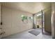 Enclosed back porch with wood paneled walls and a door to the backyard at 417 Carvell Dr, Winter Park, FL 32792