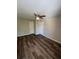 Inviting bedroom with wood look vinyl flooring and a ceiling fan and neutral walls at 4225 Thornbriar Ln # 305, Orlando, FL 32822