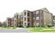 Well maintained apartment complex exterior with parking at 4225 Thornbriar Ln # 305, Orlando, FL 32822