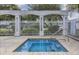 Inviting hot tub with a white pergola and fence, providing a relaxing and private outdoor space at 4225 Thornbriar Ln # 305, Orlando, FL 32822