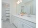 Bright bathroom with double vanity sinks, quartz countertops, and a shower and tub at 4432 Seven Canyons Dr, Kissimmee, FL 34746