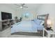 Spacious bedroom with ceiling fan, large windows and soft carpeting at 4432 Seven Canyons Dr, Kissimmee, FL 34746