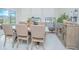 Dining room features a wooden table, six chairs and a view of backyard at 4432 Seven Canyons Dr, Kissimmee, FL 34746