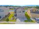 Two-story home with attached two-car garage, beautiful landscaping and backyard pond view at 4432 Seven Canyons Dr, Kissimmee, FL 34746