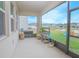 Covered patio overlooking the backyard, perfect for relaxation and outdoor enjoyment at 4432 Seven Canyons Dr, Kissimmee, FL 34746