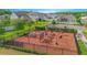 A large, fenced-in playground area is covered with mulch, surrounded by landscaping and walking paths at 4432 Seven Canyons Dr, Kissimmee, FL 34746