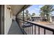 View from a screened balcony showing the parking area and building exterior, plus seating at 4465 Ring Neck Rd # C, Orlando, FL 32808