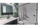 Clean bathroom featuring a tub with shower, modern vanity, and sleek fixtures at 4465 Ring Neck Rd # C, Orlando, FL 32808