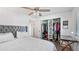 Comfortable bedroom with a view of the closet and an organized workspace by the window at 4465 Ring Neck Rd # C, Orlando, FL 32808