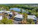 Exterior view of condos with ground floor garages and screened in second story patios overlooking mature trees at 4465 Ring Neck Rd # C, Orlando, FL 32808