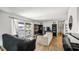 Bright living room with balcony access, hardwood floors and open floor plan at 4465 Ring Neck Rd # C, Orlando, FL 32808