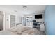 Bright bedroom with a private balcony, workspace, and comfortable bed setting at 4465 Ring Neck Rd # C, Orlando, FL 32808