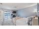 Relaxing main bedroom with a balcony, a desk, and a comfortable seating area at 4465 Ring Neck Rd # C, Orlando, FL 32808