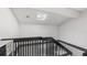 A stairway is filled with light from the skylight above at 4465 Ring Neck Rd # C, Orlando, FL 32808