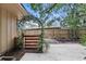 The backyard has an arbor with wooden gate and landscaped yard at 448 Sundown Trl, Casselberry, FL 32707