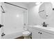 A well-lit bathroom featuring a bathtub and sink with modern fixtures at 448 Sundown Trl, Casselberry, FL 32707