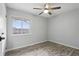 Inviting bedroom showcasing hardwood floors and a bright window at 448 Sundown Trl, Casselberry, FL 32707