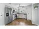 Well-lit kitchen features stainless steel appliances and light-colored cabinets at 448 Sundown Trl, Casselberry, FL 32707