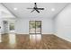 Spacious living room featuring hardwood floors, vaulted ceiling, sliding glass doors and lots of natural light at 448 Sundown Trl, Casselberry, FL 32707
