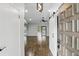 Open-concept living room with hardwood floors, sliding glass doors, recessed lighting and a vaulted ceiling at 448 Sundown Trl, Casselberry, FL 32707