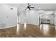 Open floor plan combines living room and kitchen with wood-look floors and recessed lighting at 448 Sundown Trl, Casselberry, FL 32707