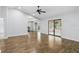 Open floor plan living room with hardwood floors, vaulted ceiling, sliding glass doors and a breakfast nook at 448 Sundown Trl, Casselberry, FL 32707