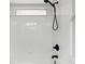 Shower featuring all white tile, black fixtures, and a window at 448 Sundown Trl, Casselberry, FL 32707
