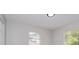 Bright room featuring neutral walls and two windows for natural light at 4739 Elkmont Rd, Orlando, FL 32808