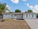 Charming single-story home with a well-maintained yard and neutral gray paint at 4739 Elkmont Rd, Orlando, FL 32808