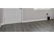 Bright living room with modern gray flooring and fresh paint at 4739 Elkmont Rd, Orlando, FL 32808