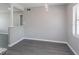 Open-concept living space with gray walls and gray flooring for easy living at 4739 Elkmont Rd, Orlando, FL 32808
