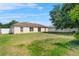 Expansive backyard showing lush green grass and a privacy fence at 504 Delido Way, Kissimmee, FL 34758