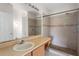 Bathroom with single sink vanity and a walk-in shower at 504 Delido Way, Kissimmee, FL 34758