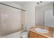 Cozy bathroom offers a standard tub with shower and wooden vanity at 504 Delido Way, Kissimmee, FL 34758