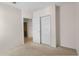 Bright bedroom features neutral walls, carpet, and a closet with bifold doors at 504 Delido Way, Kissimmee, FL 34758