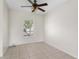 Bedroom with neutral walls, tile flooring and a window at 504 Delido Way, Kissimmee, FL 34758