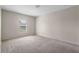 Bedroom with neutral walls, carpet flooring and a window at 504 Delido Way, Kissimmee, FL 34758