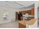 Well-lit kitchen with ample counter space and appliances, with a view to outside at 504 Delido Way, Kissimmee, FL 34758