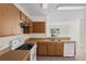 Functional kitchen with wood cabinets, and appliances for easy meal preparation at 504 Delido Way, Kissimmee, FL 34758