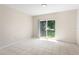 Inviting living room features tiled floors and sliding glass doors to the outside at 504 Delido Way, Kissimmee, FL 34758
