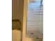 Bathroom with a large tub and glass shower doors at 508 Royal Tree Ln, Oviedo, FL 32765