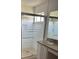 Bathroom featuring a glass door shower with a privacy film and a single sink vanity at 508 Royal Tree Ln, Oviedo, FL 32765