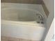 Large white bathtub with a chrome faucet and white tile surround at 508 Royal Tree Ln, Oviedo, FL 32765