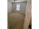 Simple bedroom features neutral carpet and a window at 508 Royal Tree Ln, Oviedo, FL 32765