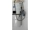 NuTone central vacuum unit installed on a white wall at 508 Royal Tree Ln, Oviedo, FL 32765