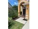 Home entrance with walkway and landscape at 508 Royal Tree Ln, Oviedo, FL 32765