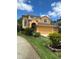 Two-story home with attached garage and landscaped front yard at 508 Royal Tree Ln, Oviedo, FL 32765