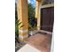 Inviting front entrance with a decorative tiled porch, planters, and a sturdy, double-door entry to the home at 508 Royal Tree Ln, Oviedo, FL 32765