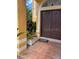 Home's inviting entrance features a tiled porch, decorative planters, and a sturdy, double-door entry at 508 Royal Tree Ln, Oviedo, FL 32765